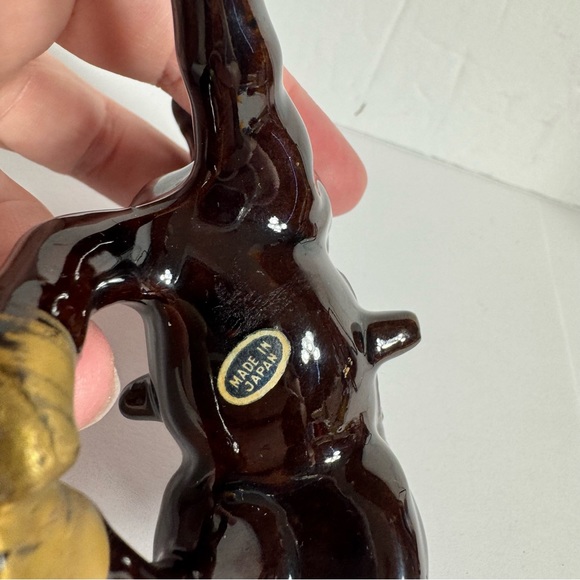 Vintage small brown ceramic horse figurine featuring gold trim and a red saddle. - Picture 10 of 10